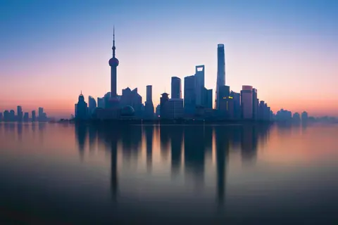 The Lujiazui skyline of Shanghai at dusk, seen across the Huangpu River
